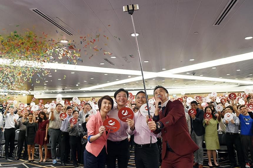 (Foreground, from left) Ms Low Yen Ling, Parliamentary Secretary for Culture, Community and Youth; Mr Lawrence Wong, Minister for Culture, Community and Youth; Mr Desmond Lee, chairman of the Youth Corps Singapore Advisory Committee, and event emcee 