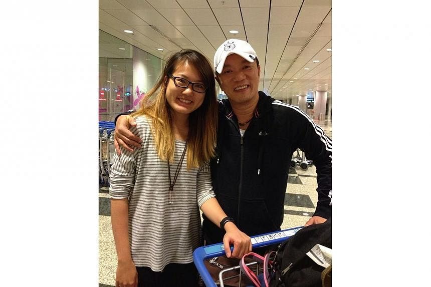 The author with her father, Mr Kenny Thor Kim Ho, at Changi Airport. -- ST PHOTO:&nbsp;VENESSA THOR