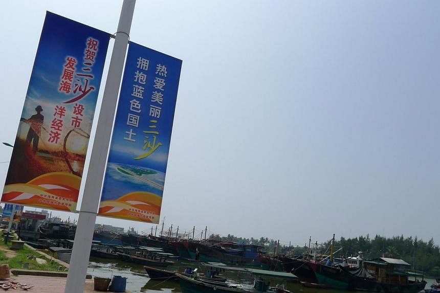Posters adorn lamp posts in Tanmen fishing village, urging locals to "love Sansha city, embrace China's blue-water territory".&nbsp;China has begun building a school on Sansha, part of the contested Paracel islands, state media reported, as the Asian