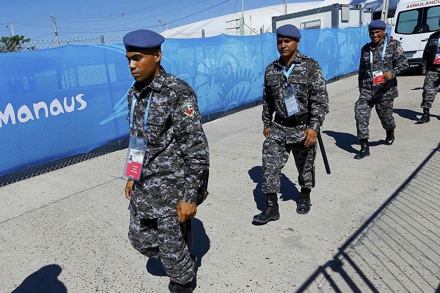 Brazilian police officers arrive at the stadium ahead of the World Cup soccer match between England and Italy in Manaus June 14, 2014.&nbsp;Police in the Brazilian state of Mato Grosso are investigating the alleged attempted rape of an American woman