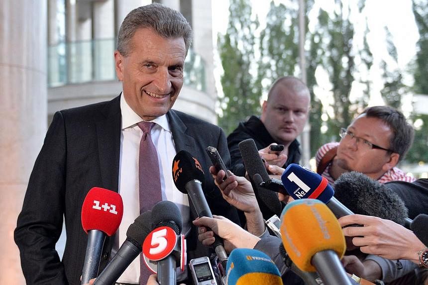 EU Energy Commissioner Guenther Oettinger speaks to the media prior to a round of talks with Russian Gazprom company and Ukraine's energy minister, in Kiev on June 14, 2014. -- PHOTO: AFP&nbsp;