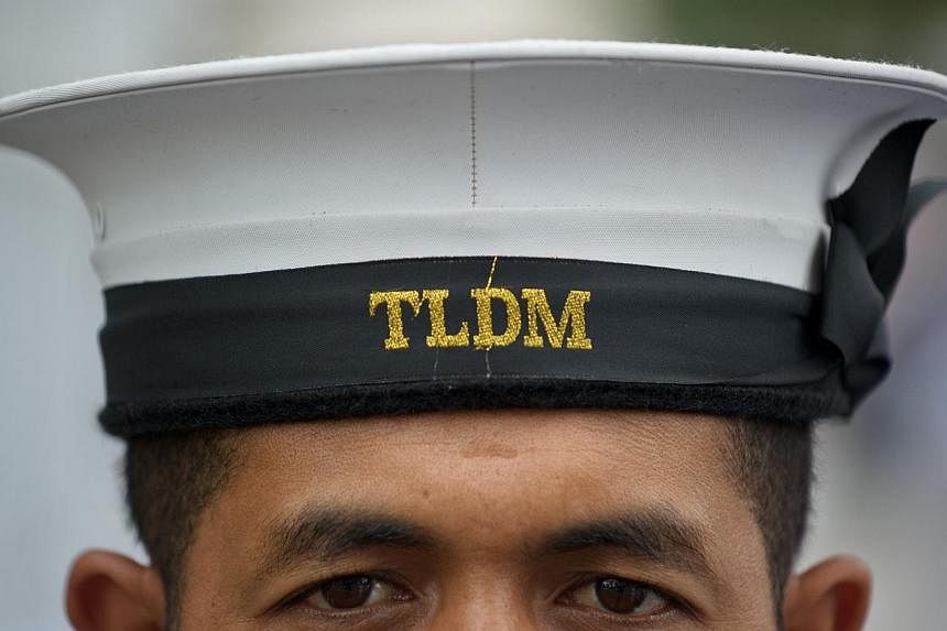 A Royal Malaysian Navy personnel stands to attention before the arrival of Chief Of Royal Australian Navy Vice Admiral Ray Griggs at the Defence Ministry in Kuala Lumpur on May 12, 2014.&nbsp;Malaysia's navy has fought off a pirate attack on a tanker