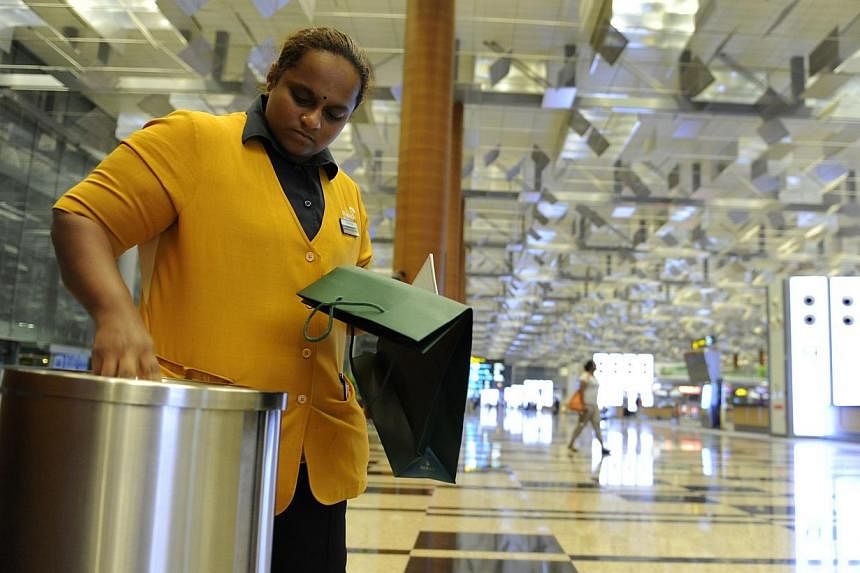 Madam Pusparani Mohan resuming work as a cleaner at Changi Terminal 3.&nbsp;When Malaysian cleaner Chandra Mogan Panjanathan, 34, was killed in a freak accident at Changi Airport two years ago, Singaporeans dug into their pockets to help his widow an