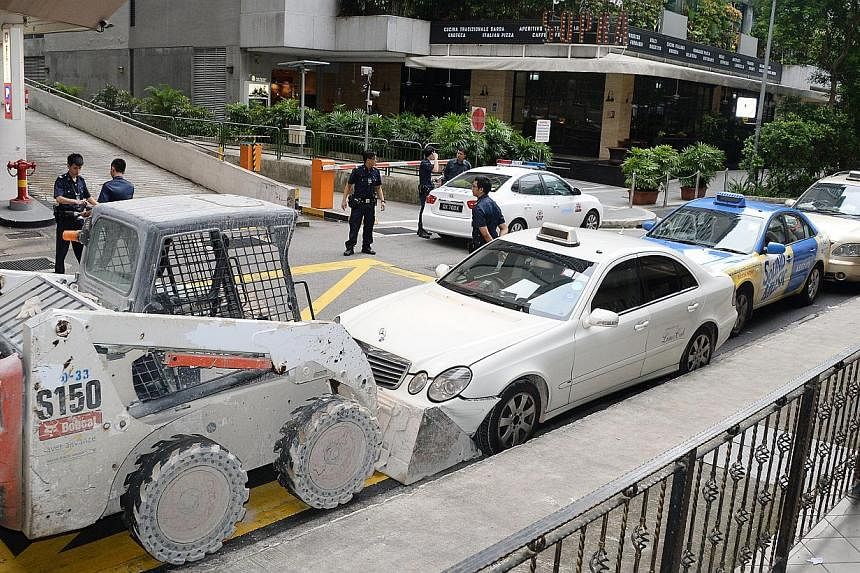 After taking a tractor from a work site near Orchard Road, the man, believed to have been drunk, crashed into a bus stop before driving to Claymore Road, where he hit a taxi. He then rammed into a row of three others along Claymore Drive.