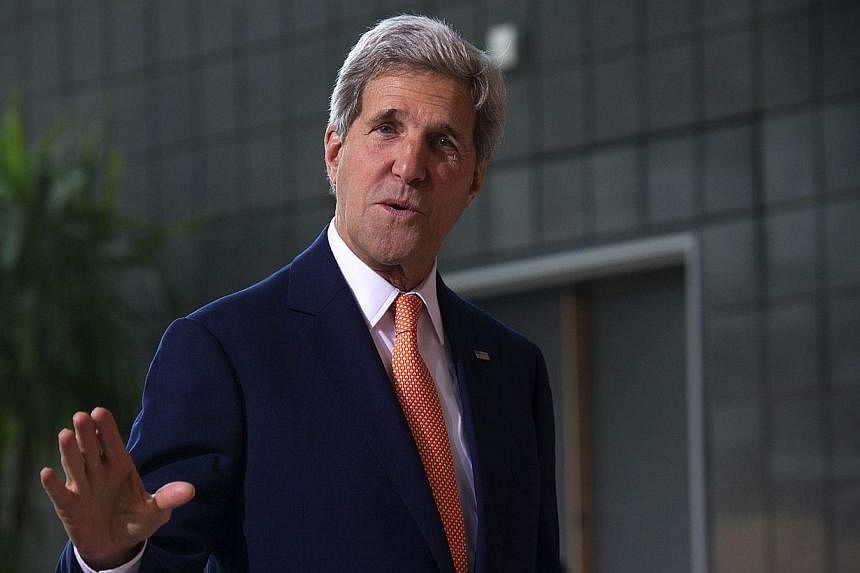 US Secretary of State John Kerry arrives for the Global Summit to End Sexual Violence in Conflict in London on June 13, 2014.&nbsp;US Secretary of State John Kerry Monday called for a global strategy to save the world's oceans, saying everyone had a 