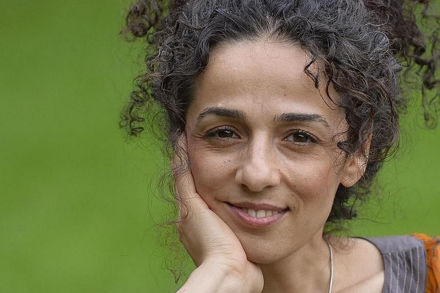 Masih Alinejad, 37, a Britain-based Iranian journalist, poses for a portrait in London in this Oct 8, 2013, file photo.&nbsp;When Ms Masih Alinejad posted a picture of herself online jumping in the air in a sunny, tree-lined London street, the journa
