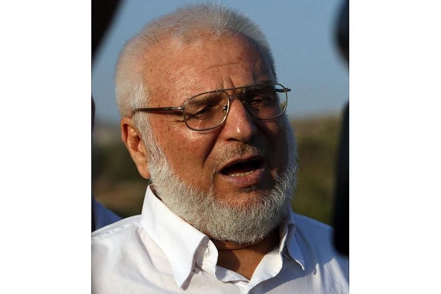 A file picture taken on Jan 19, 2012, shows then Hamas speaker of the Palestinian parliament Aziz Dweik talking to reporters after he was released from Israeli prison, at the Beit Sira roadblock in the West Bank.&nbsp;Israeli troops arrested Palestin