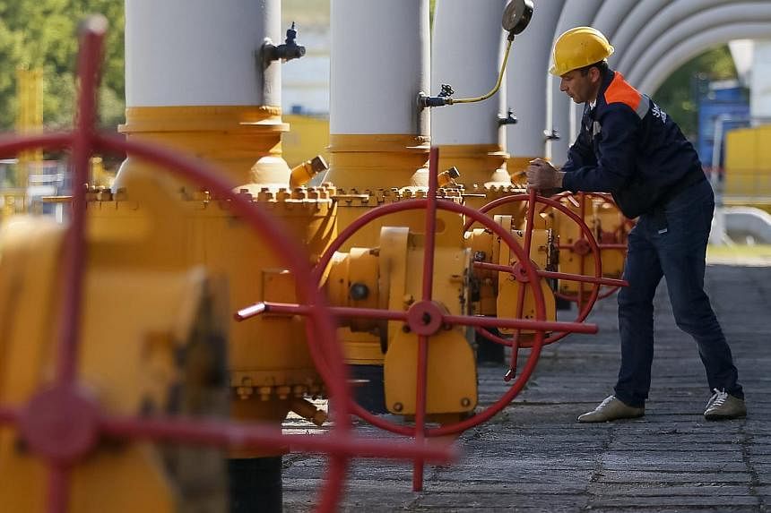 A worker turns a valve at an underground gas storage facility near Striy in western Ukraine in this May 21, 2014, file photo.&nbsp;Russia warned Europe on Monday of possible supply disruptions if Ukraine siphons off gas destined for the West, as it s