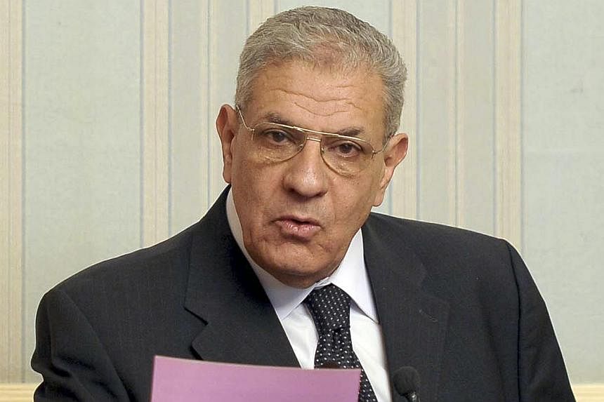 Egypt's Prime Minister Ibrahim Mehleb talks during a news conference at the presidential palace in Cairo, in this March 2, 2014 file picture. -- PHOTO: REUTERS