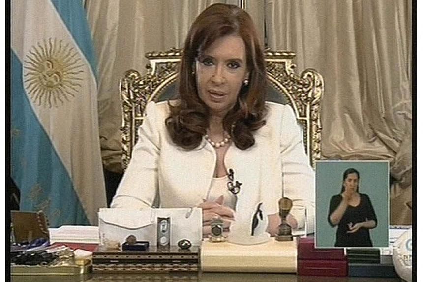 TV grab released by Noticias Argentinas showing Argentine President Cristina Fernandez de Kirchner addressing the nation, in Buenos Aires on June 16, 2014 just hours after the US Supreme Court turned back Argentina's appeals against paying at least $