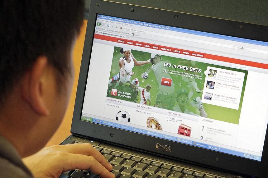 Posed photo of a man looking at an online sports betting site. -- PHOTO: ST FILE