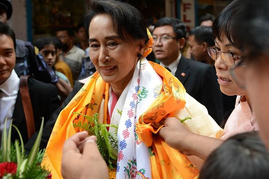 The US urged Myanmar on Monday to allow its people to freely choose the next president amid a row over a law which would ban opposition leader Aung San Suu Kyi (above) from running. -- PHOTO: AFP