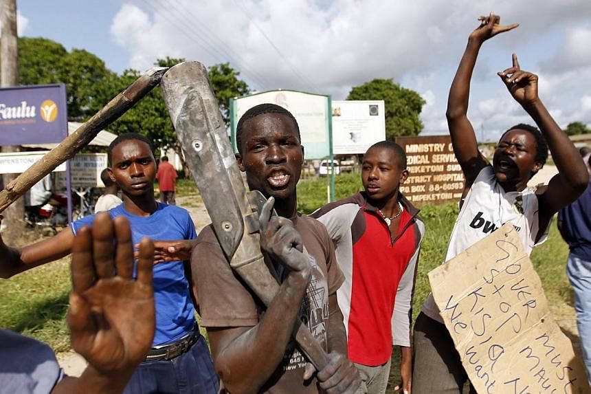 Residents chant slogans as they protest along the streets after unidentified gunmen recently attacked the coastal Kenyan town of Mpeketoni, June 17, 2014.&nbsp;Kenyan authorities on Wednesday denied reports that several women were kidnapped during th