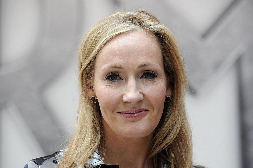 Harry Potter creator J.K. Rowling poses for photographers during the launch of her new project 'www.pottermore.com' in central London on June 23, 2011. -- PHOTO: AFP
