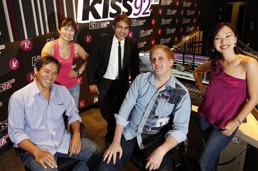 DJs (from left) Arnold Gay, Melody Chen, John Klass, Jason Johnson, and Maddy Barber helped&nbsp;Kiss92 emerge as Singapore's No. 1 English music station in the latest Nielsen radio survey results, released on Wednesday, June 18, 2014.&nbsp;-- PHOTO: