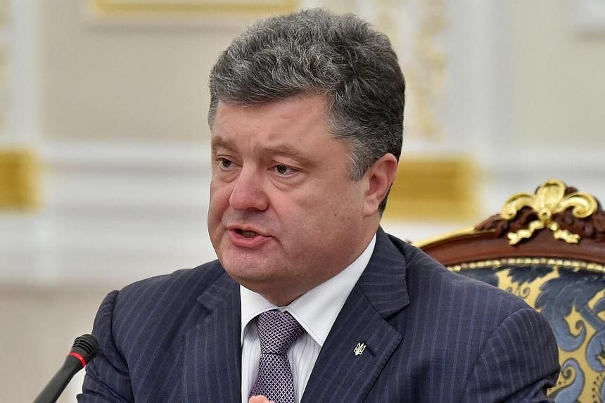 Ukrainian President Petro Poroshenko speaks during a National Security and Defence Council sitting in Kiev on June 16, 2014. Ukrainian President Petro Poroshenko asked parliament on Wednesday to dismiss the country's central bank governor, Stepan Kub
