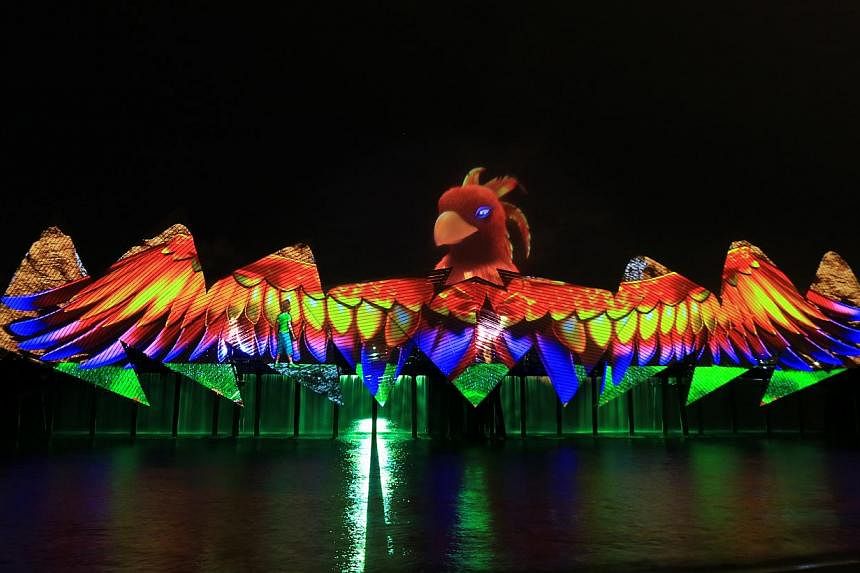 The kelong backdrop for Songs of the Sea has been replaced by a larger, angular one inspired by a bird's wings for a new show called Wings of Time, that opened on Tuesday night. -- PHOTO: ECA2