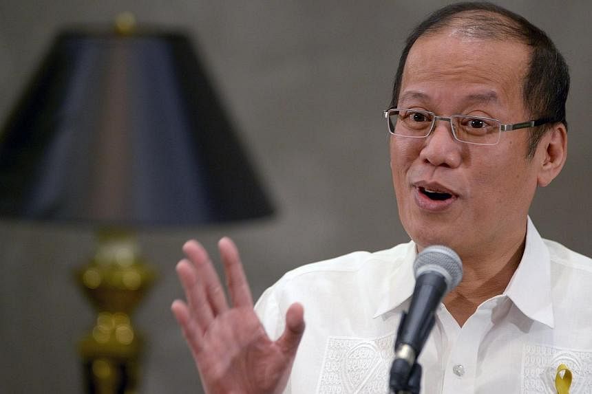 Philippine President Benigno Aquino gestures as he speaks to reporters on the sidelines of an Asia-Europe meeting in Manila on June 5, 2014.&nbsp;Philippine President Benigno Aquino will visit Japan next week, with the row over China's territorial am