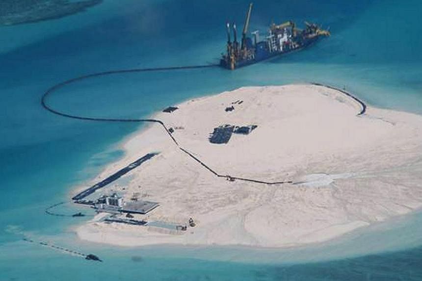 This undated handout photo released by the Department of Foreign Affairs (DFA) shows the alleged reclamation by China on what is internationally recognised as the Johnson South Reef in the South China Sea, otherwise known as the Mabini Reef by the Ph
