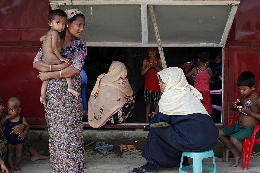 A top United Nations envoy has raised the alarm over "appalling conditions" in west Myanmar displacement camps, which hold thousands of Rohingya Muslims made homeless in communal unrest two years ago. -- PHOTO: REUTERS