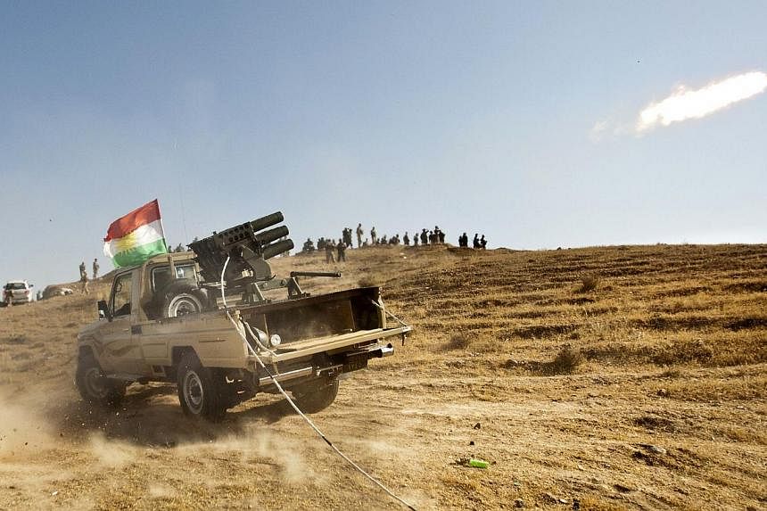 Kurdish Peshmerga forces fire missiles during clashes with militants of the Islamic State of Iraq and the Levant (ISIL) jihadist group in Jalawla in the Diyala province, on June 14, 2014.&nbsp;Saudi Arabia warned on Wednesday of the risks of a civil 