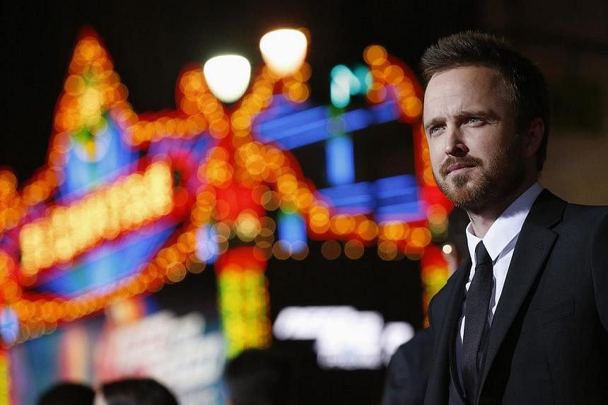 Cast member Aaron Paul poses at the premiere of the film "Need for Speed" in Hollywood, California in this file photo taken March 6, 2014. For Paul, life after "Breaking Bad" has brought him more of the dark, broken characters that he became known fo