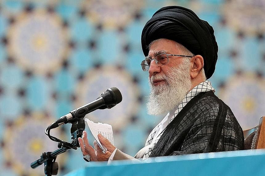 Iran's supreme leader Ayatollah Ali Khamenei delivers a speech during a ceremony marking the 25th death anniversary of Ayatollah Ruhollah Khomeini, founder of the Islamic Republic, in Teheran on June 4, 2014. -- PHOTO: REUTERS