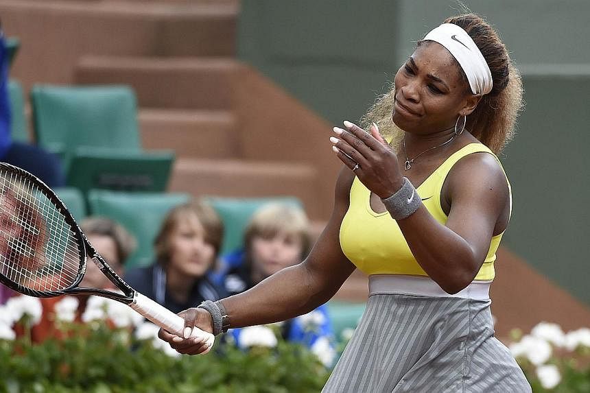 USA's Serena Williams reacts after being defeated by Spain's Garbine Muguruza at the end of their French tennis Open second round match at the Roland Garros stadium in Paris on May 28, 2014.&nbsp;Serena Williams has set her sights on erasing the bitt