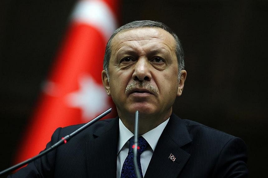 Turkey's Prime Minister Tayyip Erdogan addresses members of parliament from his ruling AK Party (AKP) during a meeting at the Turkish parliament in Ankara on June 3, 2014.&nbsp;-- PHOTO: REUTERS