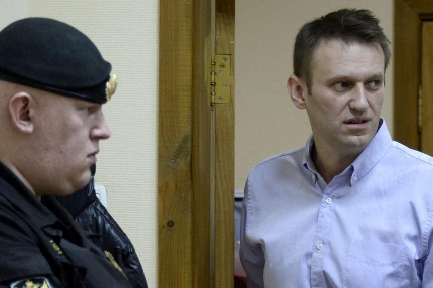 Kremlin critic and opposition leader Alexei Navalny (right) at a court hearing. Friday’s search was tied to yet another probe against him in which he is alleged to have defrauded an opposition party eight years ago.&nbsp;PHOTO: AFP