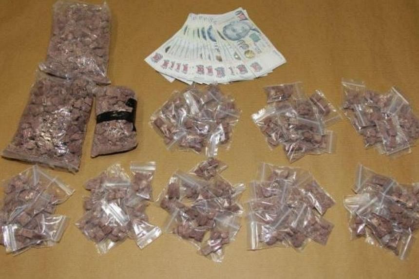 Heroin seized in a CNB operation conducted on Thursday, June 19, 2014.&nbsp;Two men, including&nbsp;a suspected Singaporean drug distributor,&nbsp;were nabbed in the bust.&nbsp;-- PHOTO:&nbsp;CENTRAL NARCOTICS BUREAU
