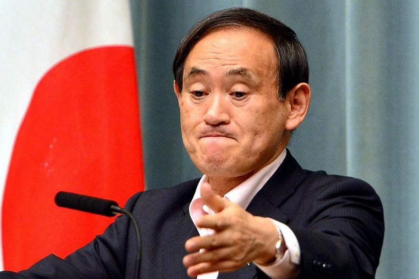 Japan's Chief Cabinet Secretary Yoshihide Suga at a press conference in Tokyo on May 29, 2014.&nbsp;Mr Suga, commenting on an expert panel report,&nbsp;repeated that Japan would not revise the statement on the "comfort women".&nbsp;-- PHOTO: AFP