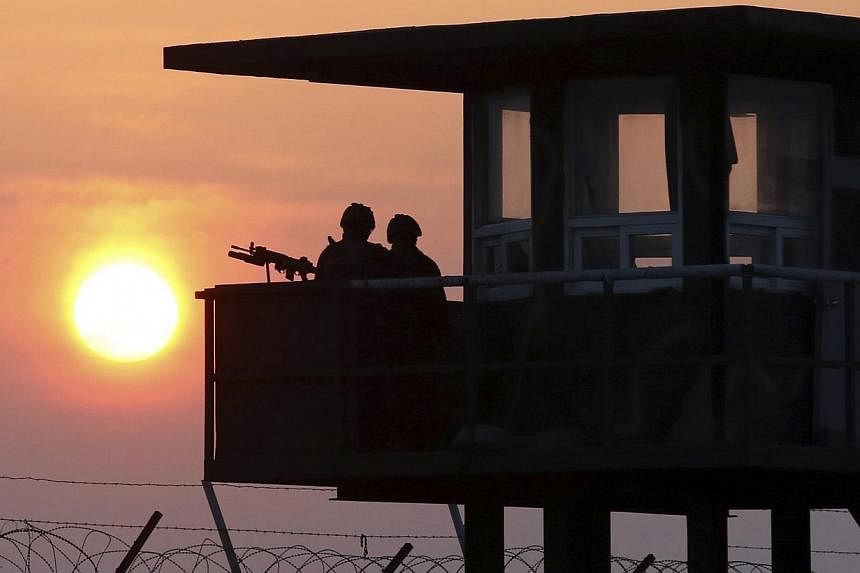 South Korean marines stand guard at a guard post on Baengnyeongdo, an island near the border with North Korea on April 2, 2014.&nbsp;A South Korean soldier on Saturday, June 21, 2014, shot and killed five members of his own unit at a guard post on th