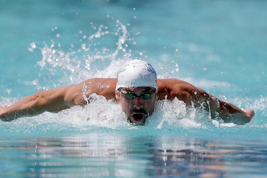 Michael Phelps competes in the men's 100m butterfly preliminaries during the 2014 Arena Grand Prix of Santa Clara at the George F. Haines International Swim Center on June 20, 2014, in Santa Clara, California.&nbsp;-- PHOTO: AFP