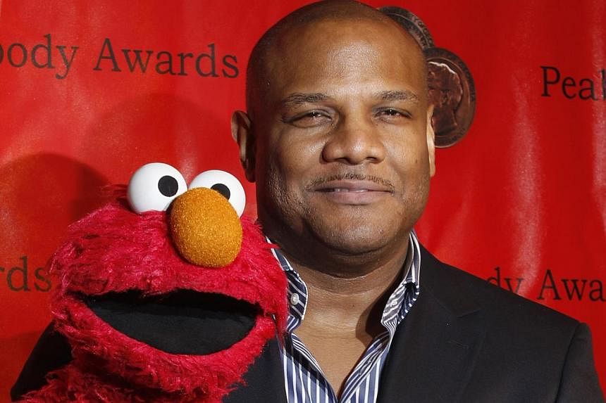 Voice actor Kevin Clash arrives with the puppet Elmo for the 2010 Peabody Award ceremony at the Waldorf Astoria in New York in this file photo taken May 17, 2010. A federal judge in Pennsylvania has dismissed a lawsuit accusing Clash, the puppeteer k