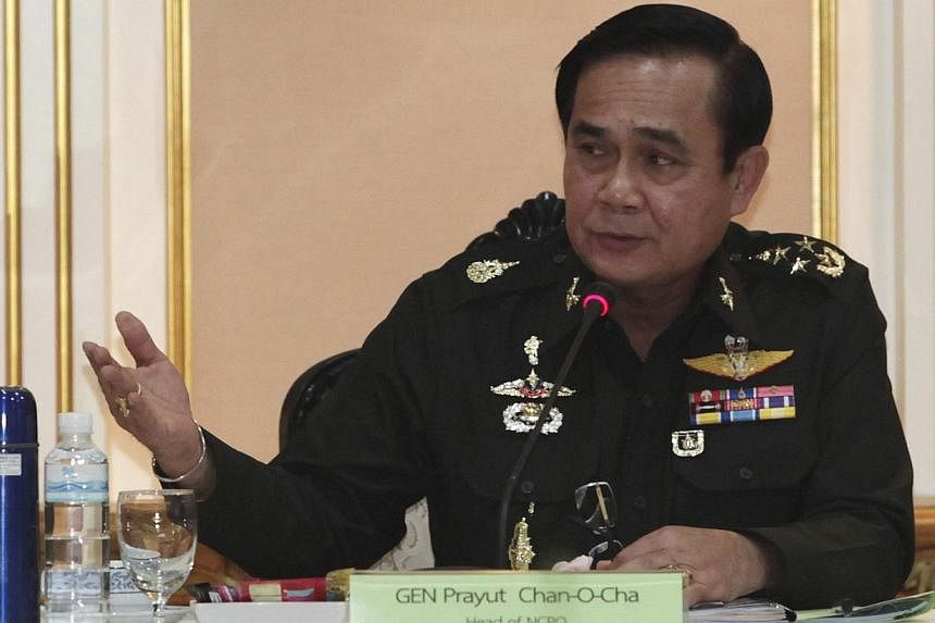Thai Army chief General Prayuth Chan-ocha speaking during a meeting with members of the International Chamber of Commerce at the Royal Thai Army Headquarters in Bangkok on June 19, 2014. -- PHOTO: REUTERS