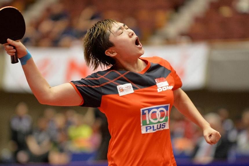 Singapore's Feng Tianwei reacts after beating Japan's Kasumi Ishikawa in their women's singles final at the Japan Open table tennis tournament in Yokohama on June 22, 2014.&nbsp;Singapore paddler Feng Tianwei claimed the women's single title at the I