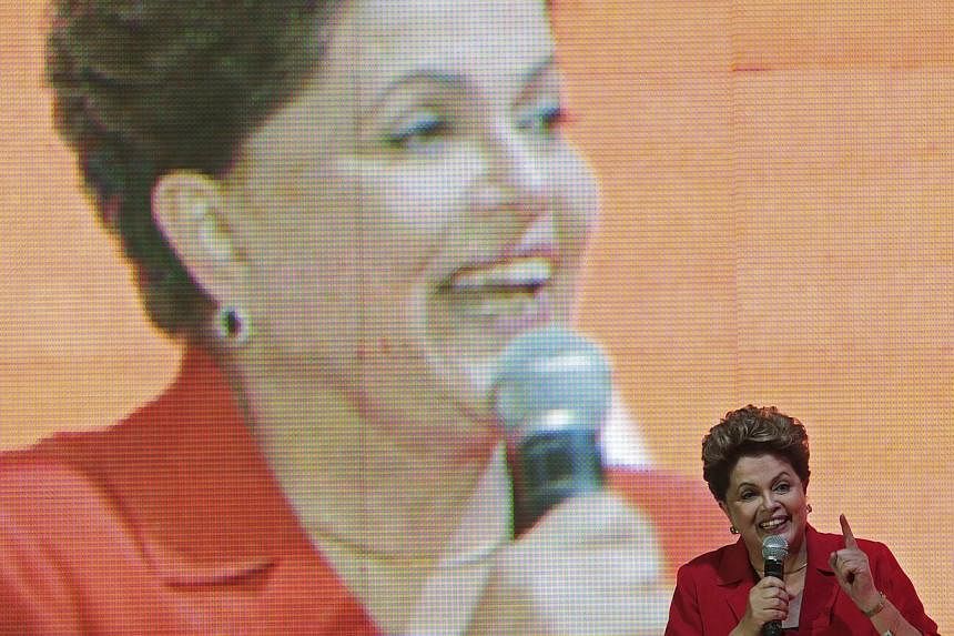 Brazil's President Dilma Rousseff gestures while speaking during the national convention of her Workers' Party (PT) in Brasilia on June 21, 2014. -- PHOTO: REUTERS