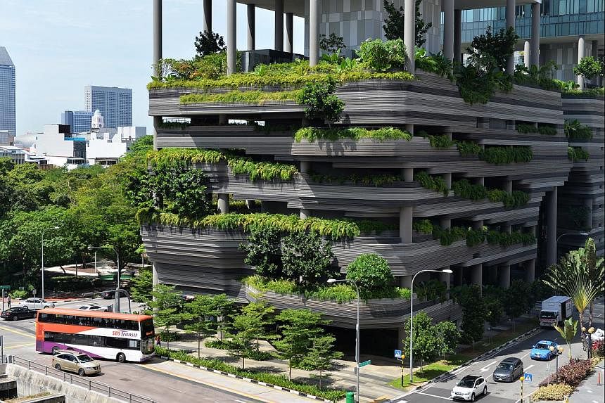 The Ocean Financial Centre (above) last held the record for being the world's largest vertical garden before The Tree House (top right) clinched it. The vertical garden at Parkroyal on Pickering is one of the 154 such projects in Singapore. Mr Bernar