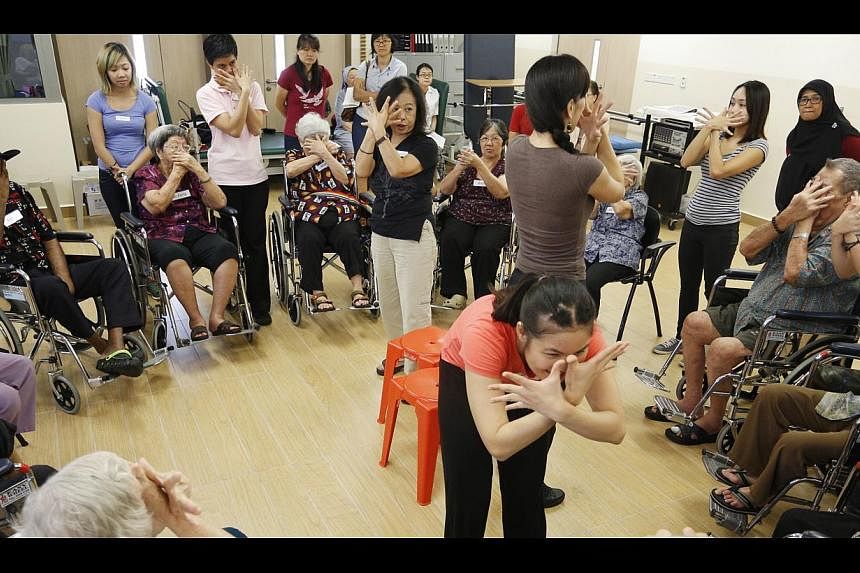 Elderly residents of the Villa Francis Home for the Aged enjoying a dance therapy session, part of a scheme to provide more recreational activities for them. At present, there is an Adult Protection Team that looks into cases of elder abuse, but it d