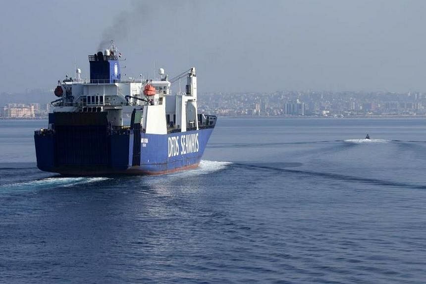 A handout picture taken on Jan 7, 2014, and released by Norwegian Armed Forces shows the Danish cargo ship "Ark Futura" arriving at the Syrian port of Latakia before being loaded with Syria's chemical agents before their transfer out of the country f