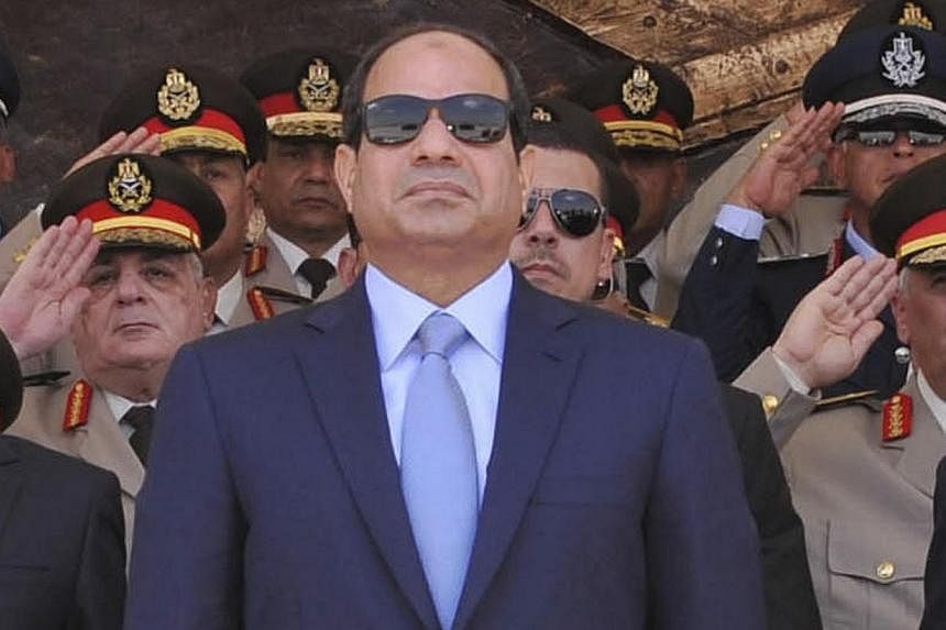 Egyptian President Abdel Fattah al-Sisi (centre) attends the graduation ceremony of the Air Force Academy in Cairo, in this June 22, 2014 picture provided by the Egyptian Presidency.&nbsp;Newly elected Egyptian President Abdel Fattah al-Sisi said on 