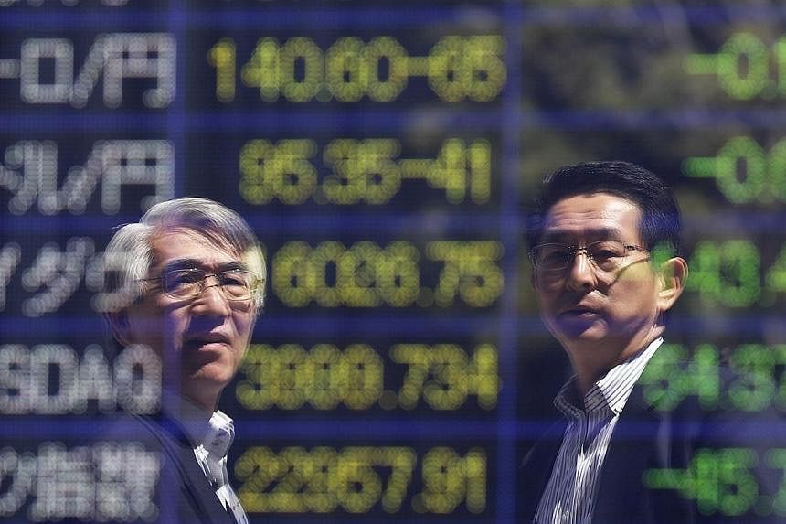 Stock market punters continued to stick to the sidelines on Tuesday, June 24, 2014, with shares little moved for a second day and trading volume remaining thin. -- PHOTO: REUTERS