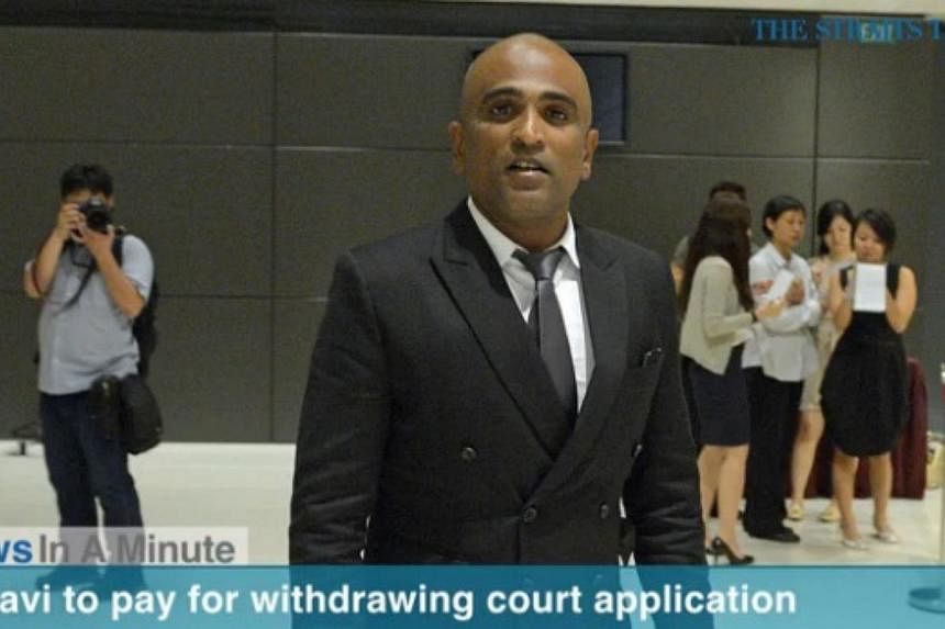 Lawyer M Ravi has been ordered to pay $1,000 for the cost of an application he made to drop charges against his five clients.&nbsp;-- PHOTO: SCREENGRAB FROM VIDEO