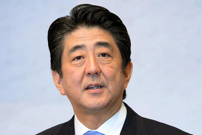 Japanese Prime Minister Shinzo Abe delivers a speech at the Japan Business Federation general assembly in Tokyo on June 3, 2014. -- PHOTO: AFP&nbsp;