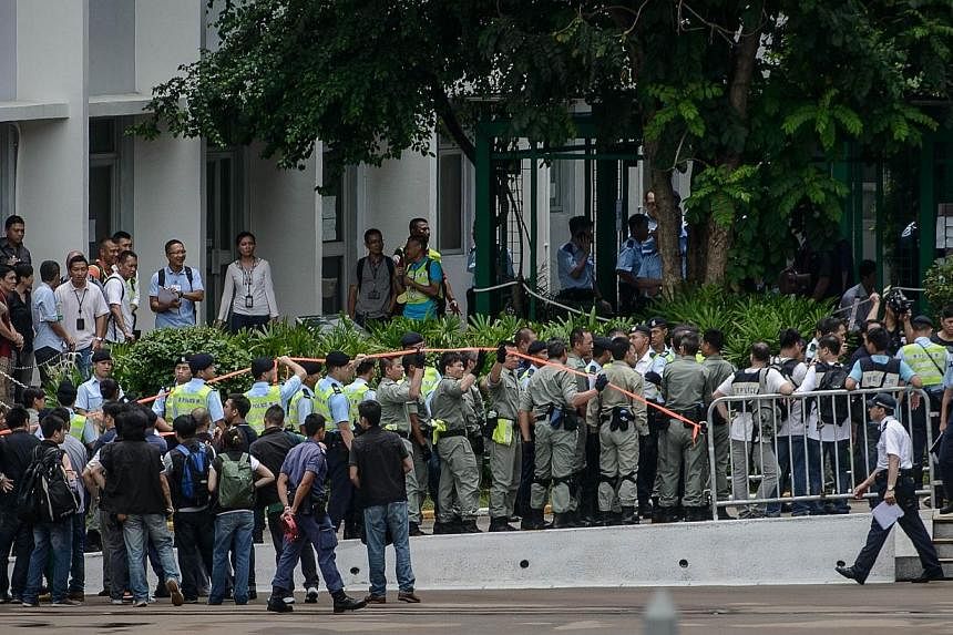 Hong Kong police carry out crowd control drills at a local police college in Hong Kong on June 25, 2014, ahead of planned July 1 protests.&nbsp;Activists said they expect more than half a million people to take to the streets on Hong Kong's annual pr