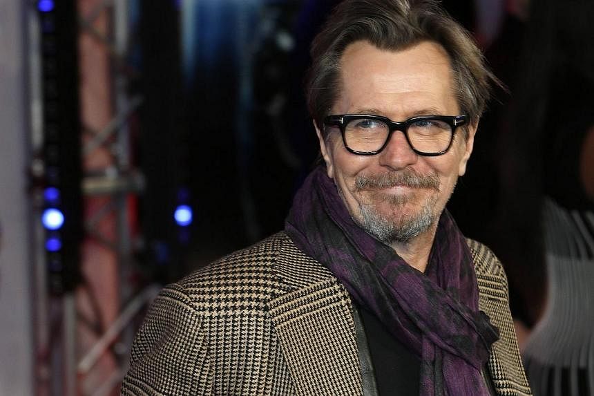 Gary Oldman poses for photographers in this Feb 5, 2014, file photo. Oldman's manager said on June 24, 2014 that the British actor was not defending Mel Gibson or Alec Baldwin in an interview about past comments they made about Jews and homosexuals, 