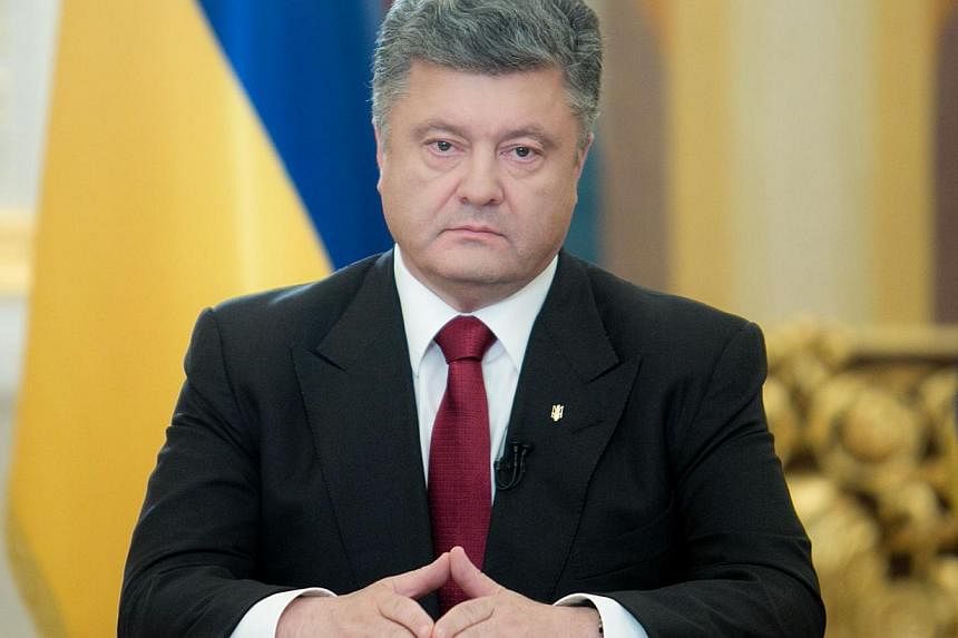 Ukraine’s new Western-backed president said on Tuesday he may revoke his one-week unilateral ceasefire to allow government forces to retaliate for the downing by pro-Russian rebels of an army helicopter that killed nine servicemen. -- PHOTO: AFP