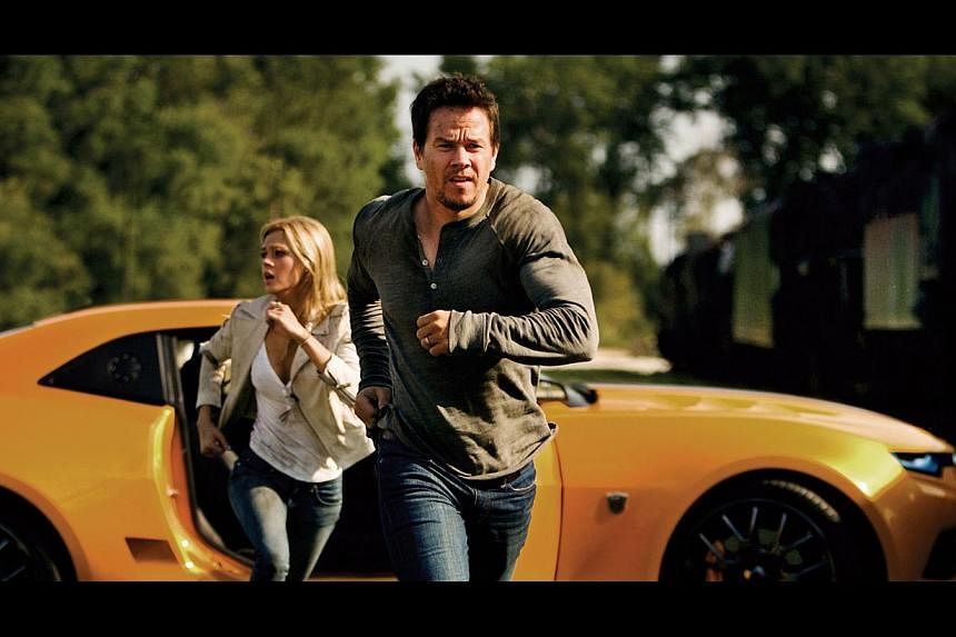 Mark Wahlberg and Nicola Peltz (both left) take over the starring roles in the latest Transformers movie.