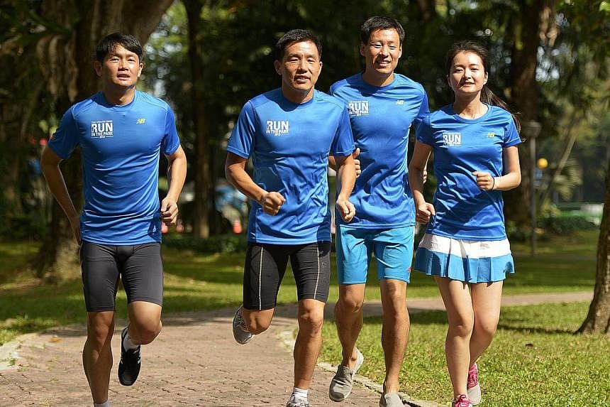 (From left) Mr Sun Yue, 34, Mr Sun Yong, 42, Mr Li Chao, 27, and Ms Lin Xiao Qing, 31, from construction firm Qingjian International. The company is sponsoring more than 100 employees' participation in the ST Run at the Hub to encourage staff to pay 